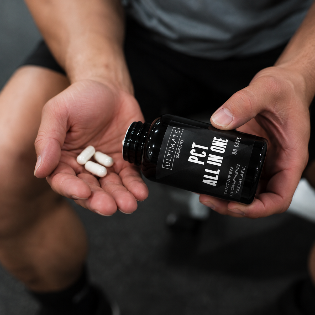 Supplement Bottle and Capsules in Gym
