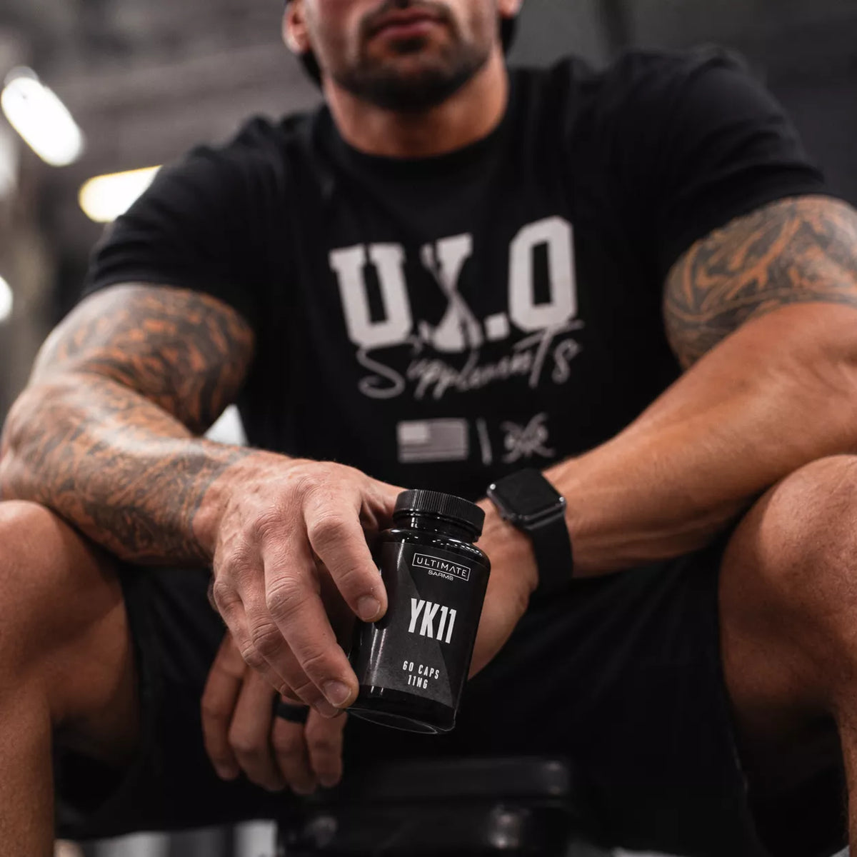 muscular gym portrait with yk11 bottle